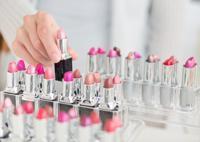 USA, New Jersey, Jersey City, Hand of woman choosing lipstick